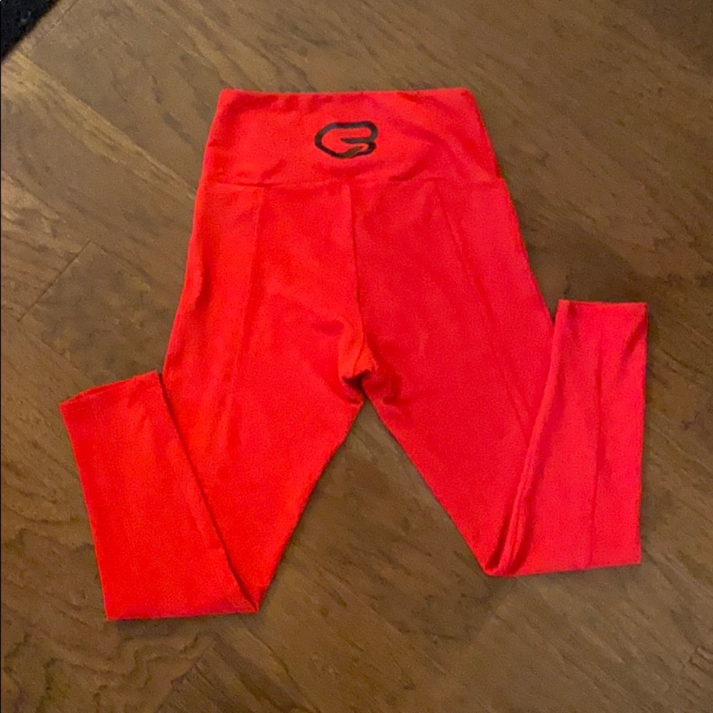 Red Onzie leggings with Cyclebar logo